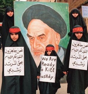 Young pro-iranian hizbullah girls demontrate in Beirut's shiite southern suburbs 26 February against indian-born british author Salman Rushdie's allegedly blasphemous book "The satanic verses". Behind is seen a poster for Iranian Iman Khomeiny who decided to execute Rushdie. CREDIT : NABIL ISMAIL/AFP ImageForum